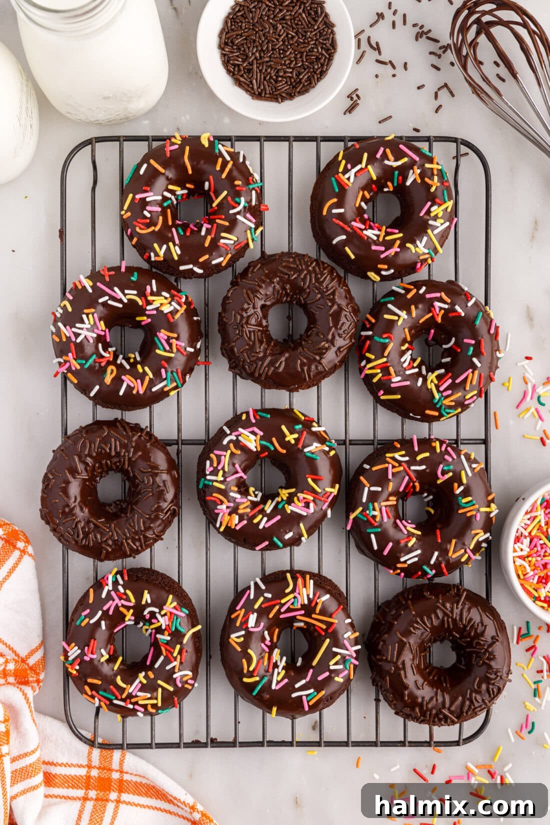 Freshly baked Bronuts cooling on a wire rack before glazing