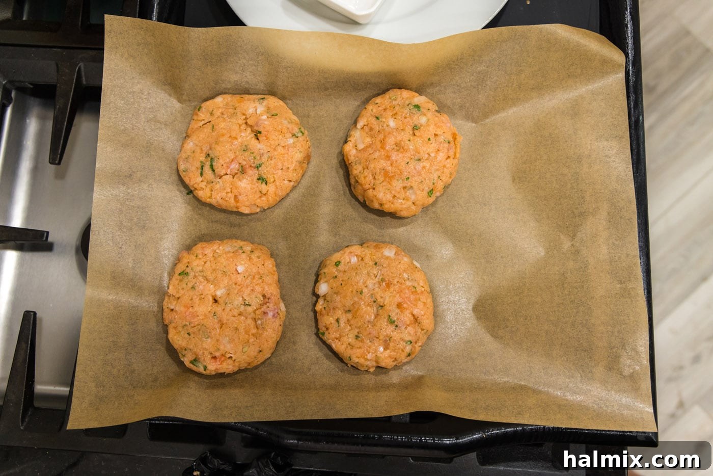 salmon patties on parchment paper