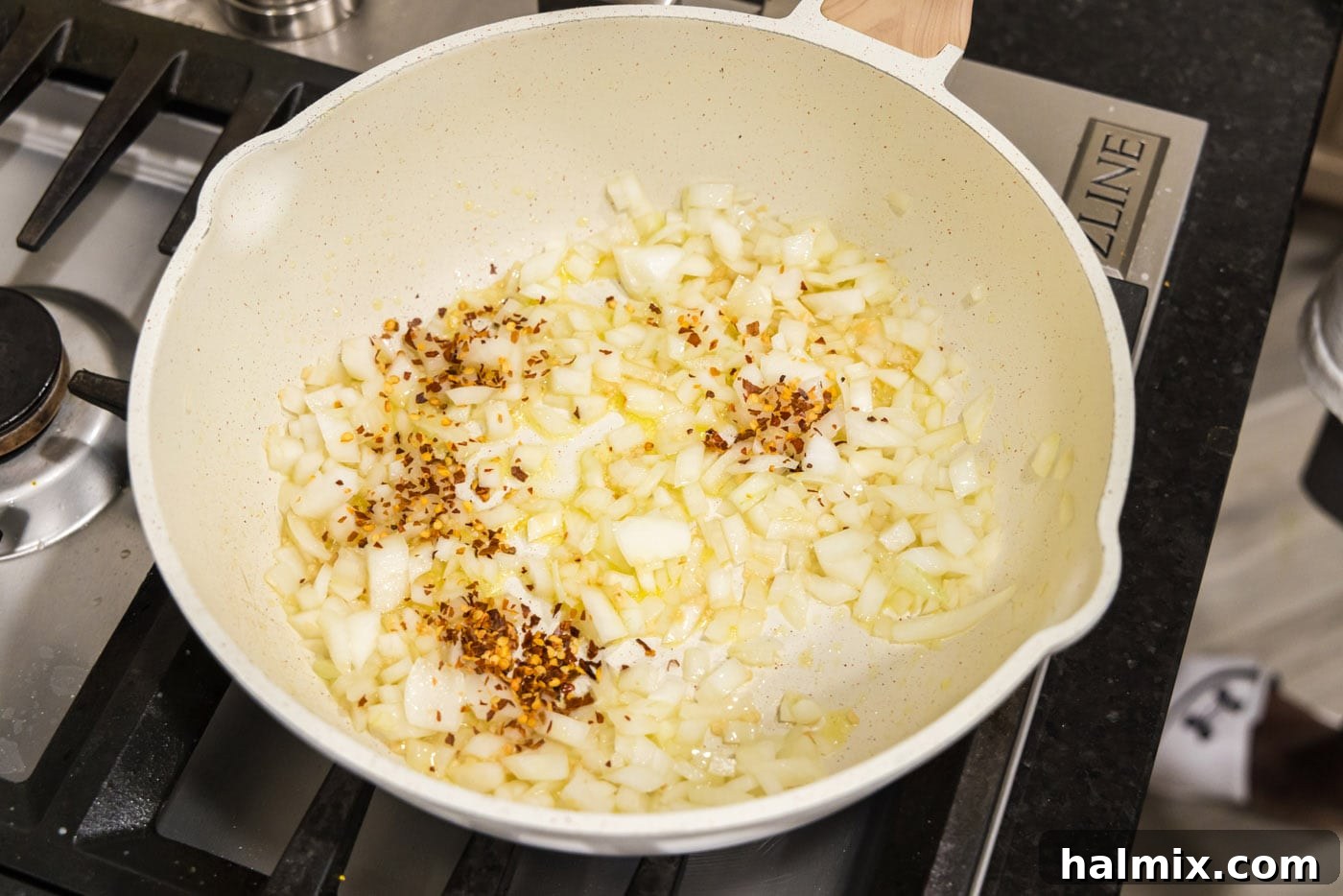 garlic, onion, and red pepper flakes in a skillet of oil