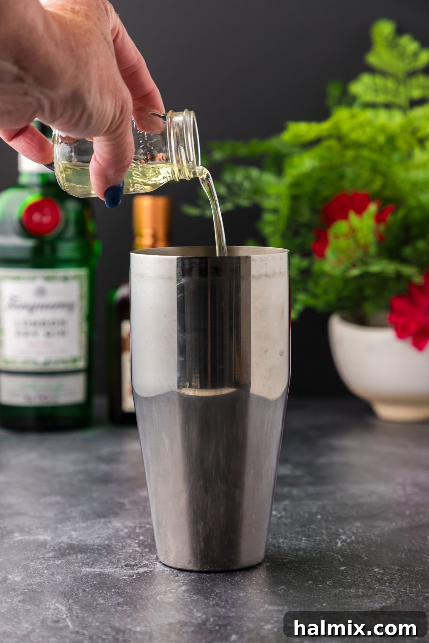 The Pale Belle 5 pouring egg whites into cocktail shaker