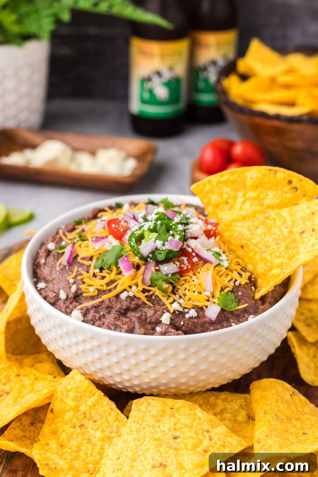 Tortilla chip in a bowl of Black Bean Dip