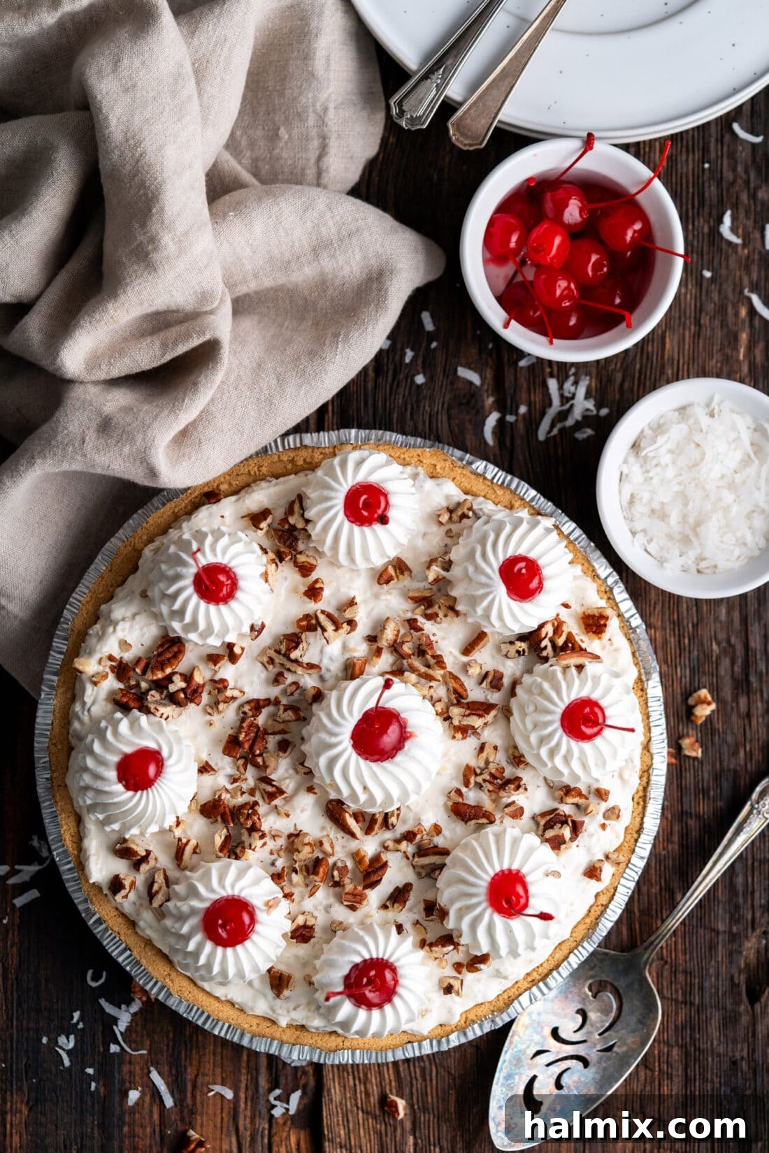 Million Dollar Pie with a bowl of cherries and shredded coconut on the side
