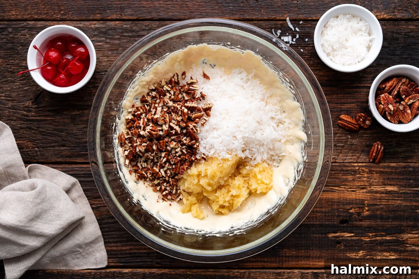 shredded coconut, crushed pineapple, and pecans added to sweetened condensed milk mixture