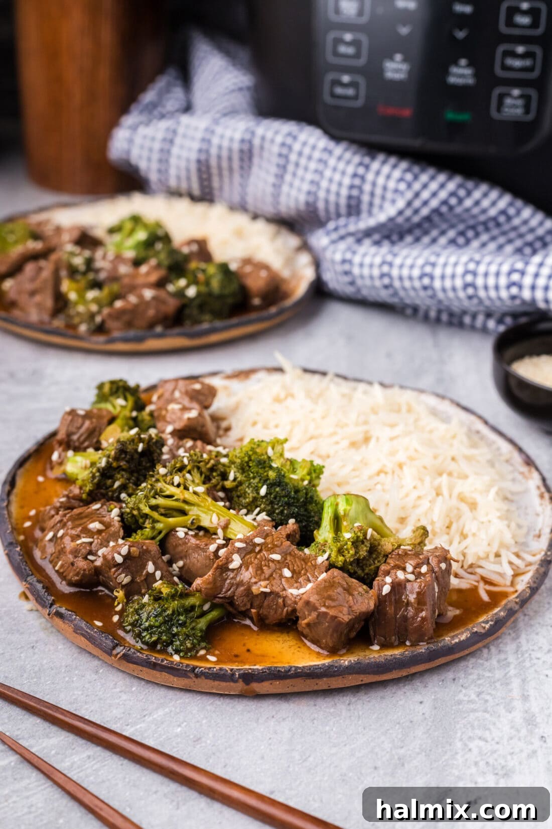 Plate of Instant Pot Beef and Broccoli with rice on the side