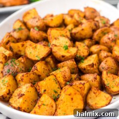 Close up photo of Spicy Potatoes, showing their vibrant color and crispy texture.