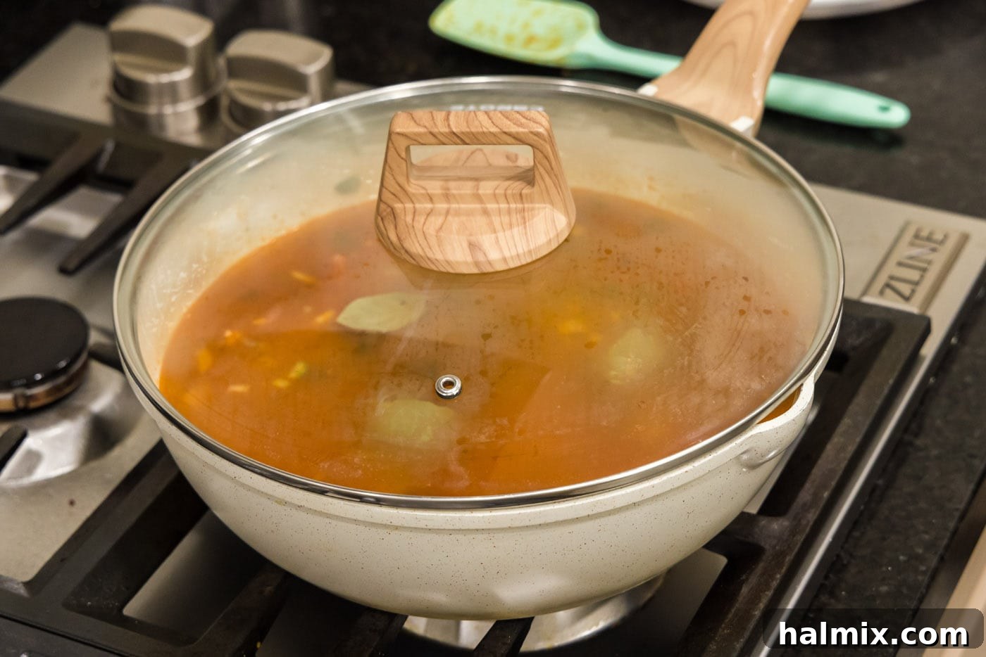 Bayou Red Beans and Rice Legacy 11 simmering red bean mixture in a covered skillet over medium heat, allowing flavors to meld