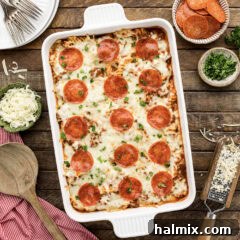 Close up photo of a casserole dish of Sausage & Pepperoni Pizza Casserole