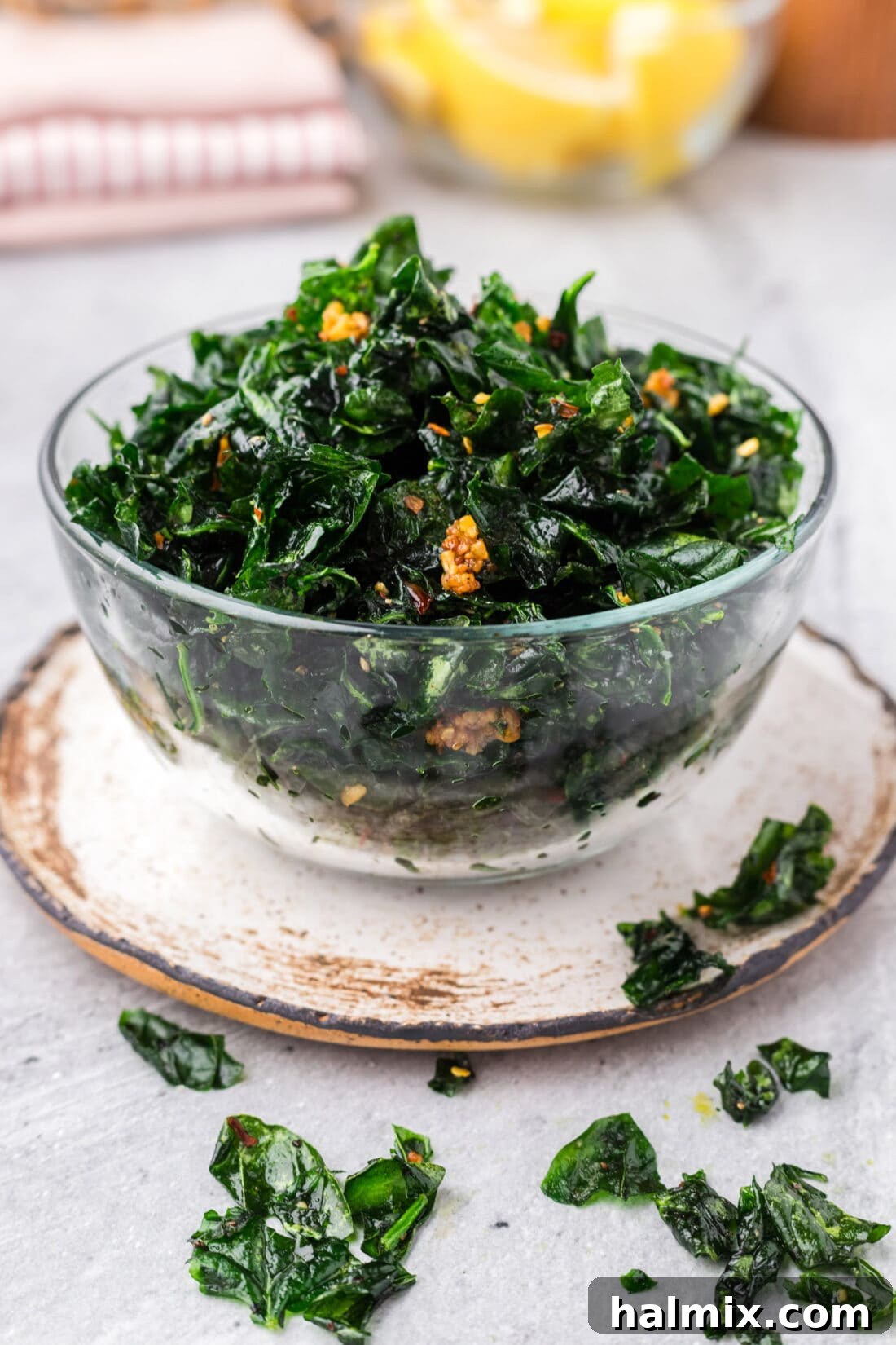 Bowl of Fried Spinach presented beautifully on a wooden surface with scattered crispy spinach pieces, ready for consumption