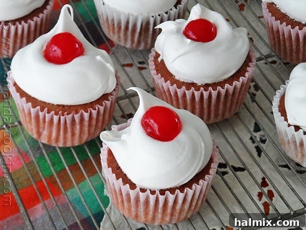 A close up photo of three ingredient cherry cupcakes.