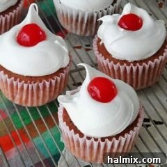 A close up photo of three ingredient cherry cupcakes.