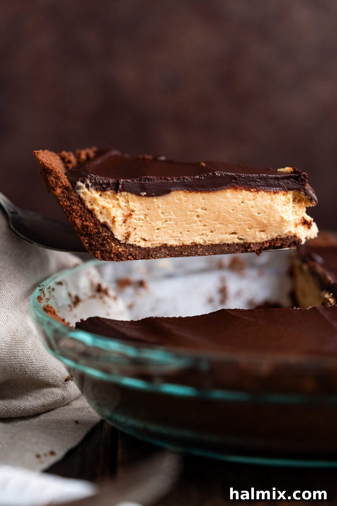 Chocolate Peanut Butter Bliss 2 Slice of Chocolate Peanut Butter Pie being lifted out of the pie dish