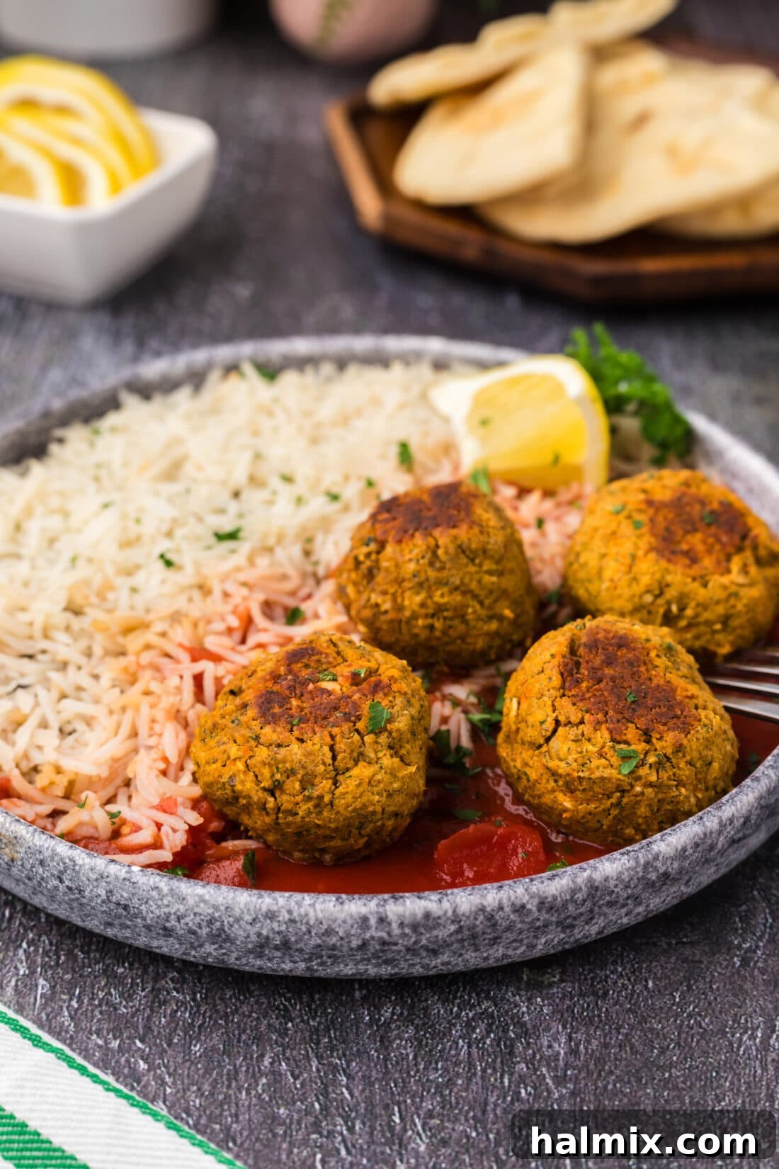 Savory Lentil Bites 2 Lentil Meatballs on a plate with rice