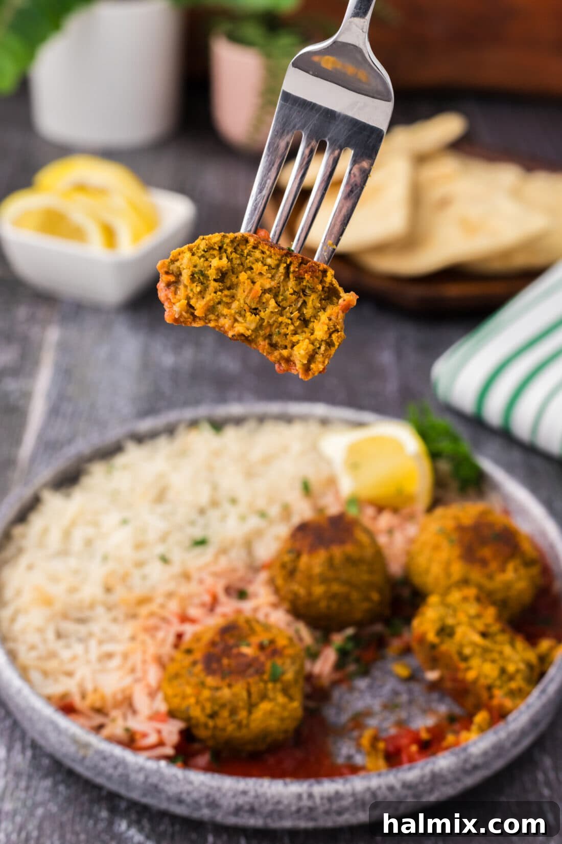 Savory Lentil Bites 14 Half of a Lentil Meatball lifted by a fork