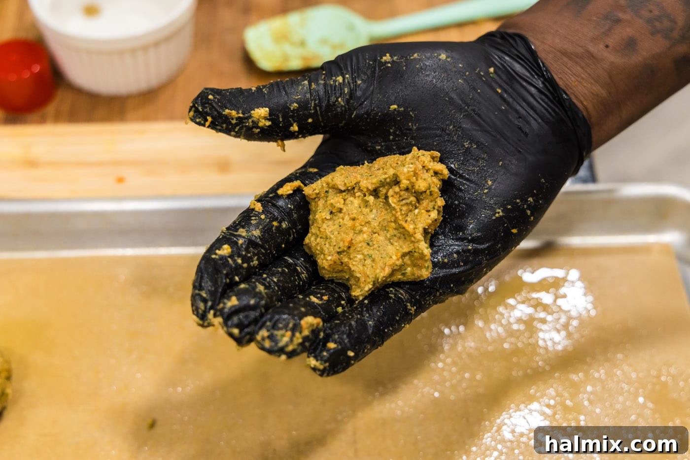 Savory Lentil Bites 10 lentil meatball mixture in palm of hand