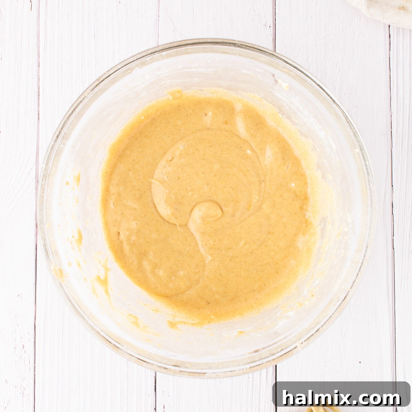 Smooth, creamy pumpkin cream cheese frosting in a mixing bowl