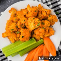 Buffalo Cauliflower on a plate with celery and carrots