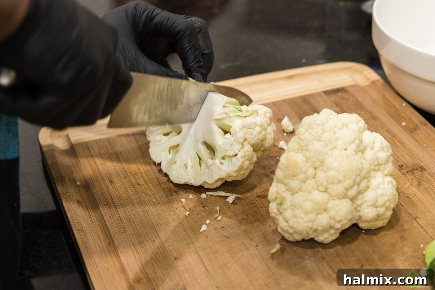 Pile of perfectly cut cauliflower florets, ready for coating.