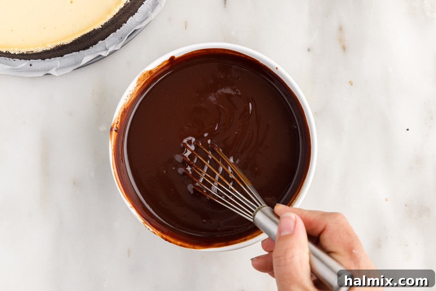 whisking melted chocolate ganache
