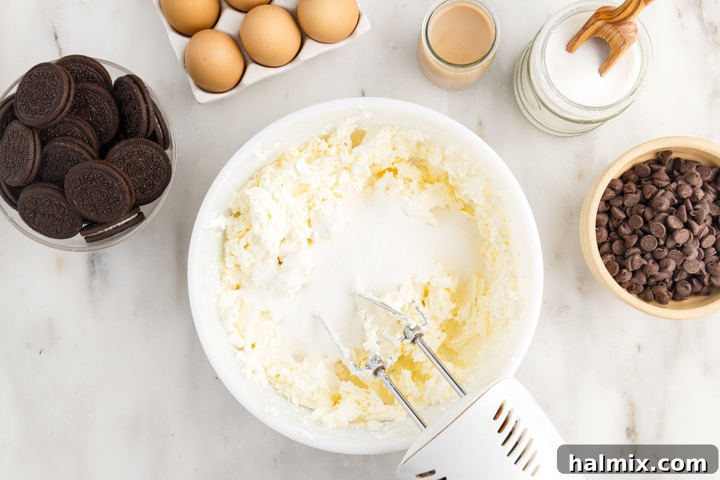 blending cream cheese with sugar with a mixer