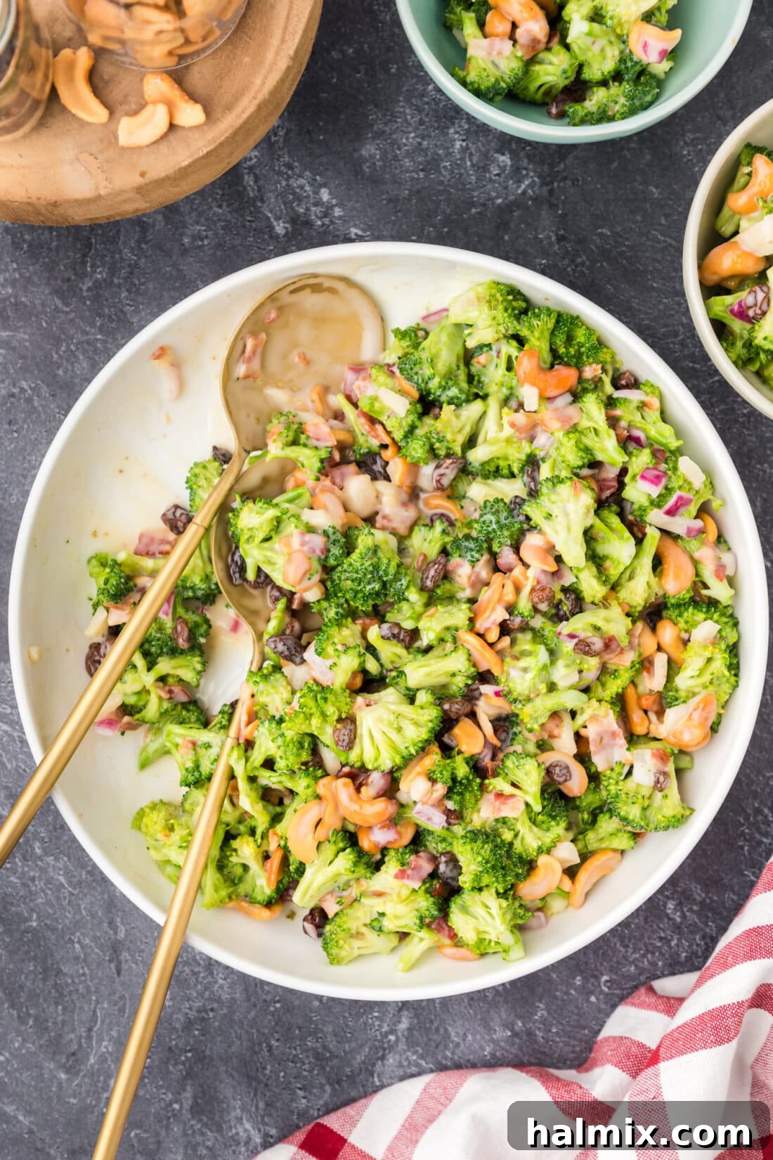 Crunchy Broccoli Cashew Delight 3 Bowl of Broccoli Cashew Salad with two spoons in it