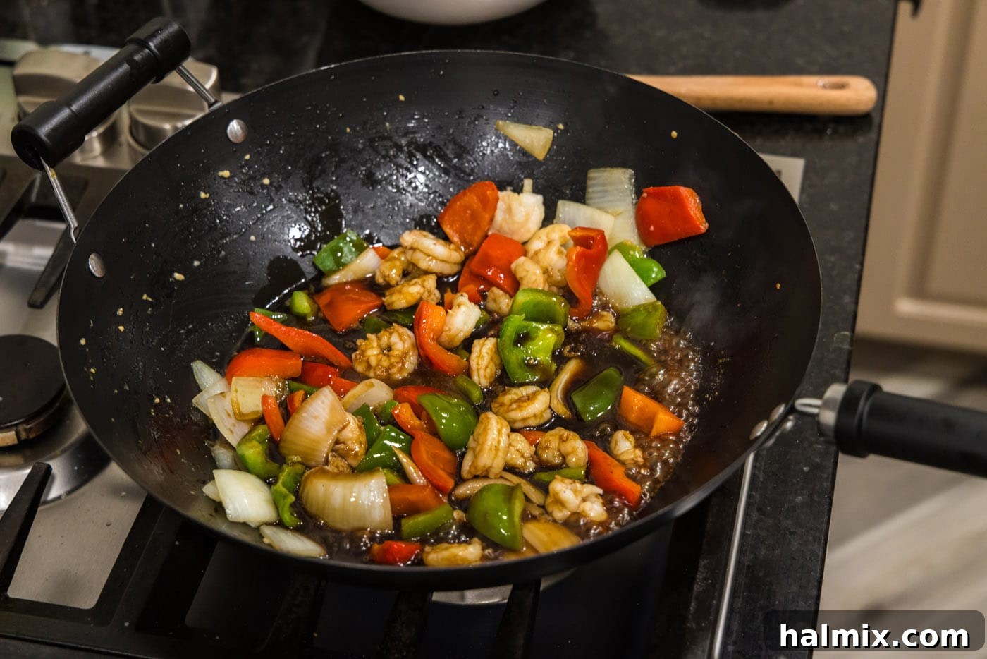 stir frying shrimp with vegetables
