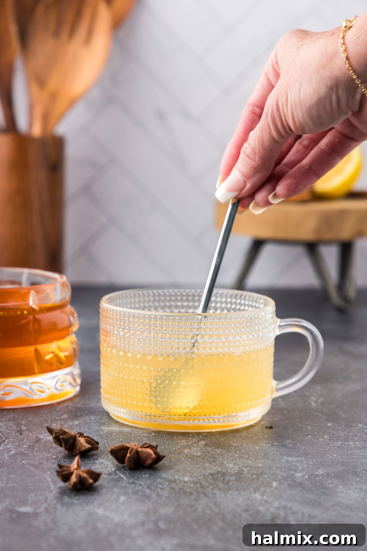 stirring hot toddy with a spoon