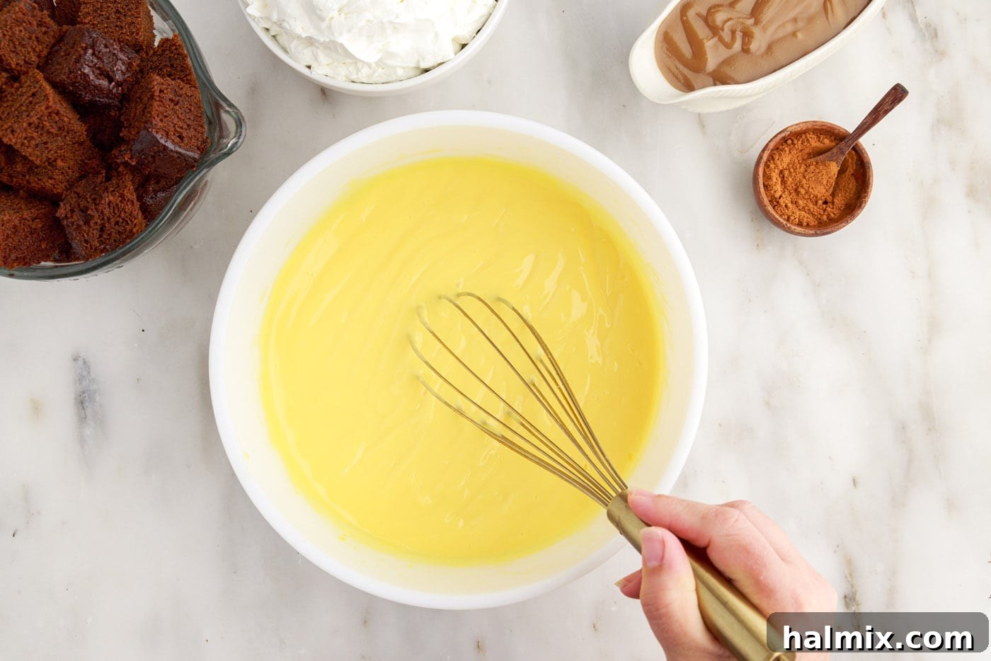 Whisking instant vanilla pudding in a bowl until it thickens