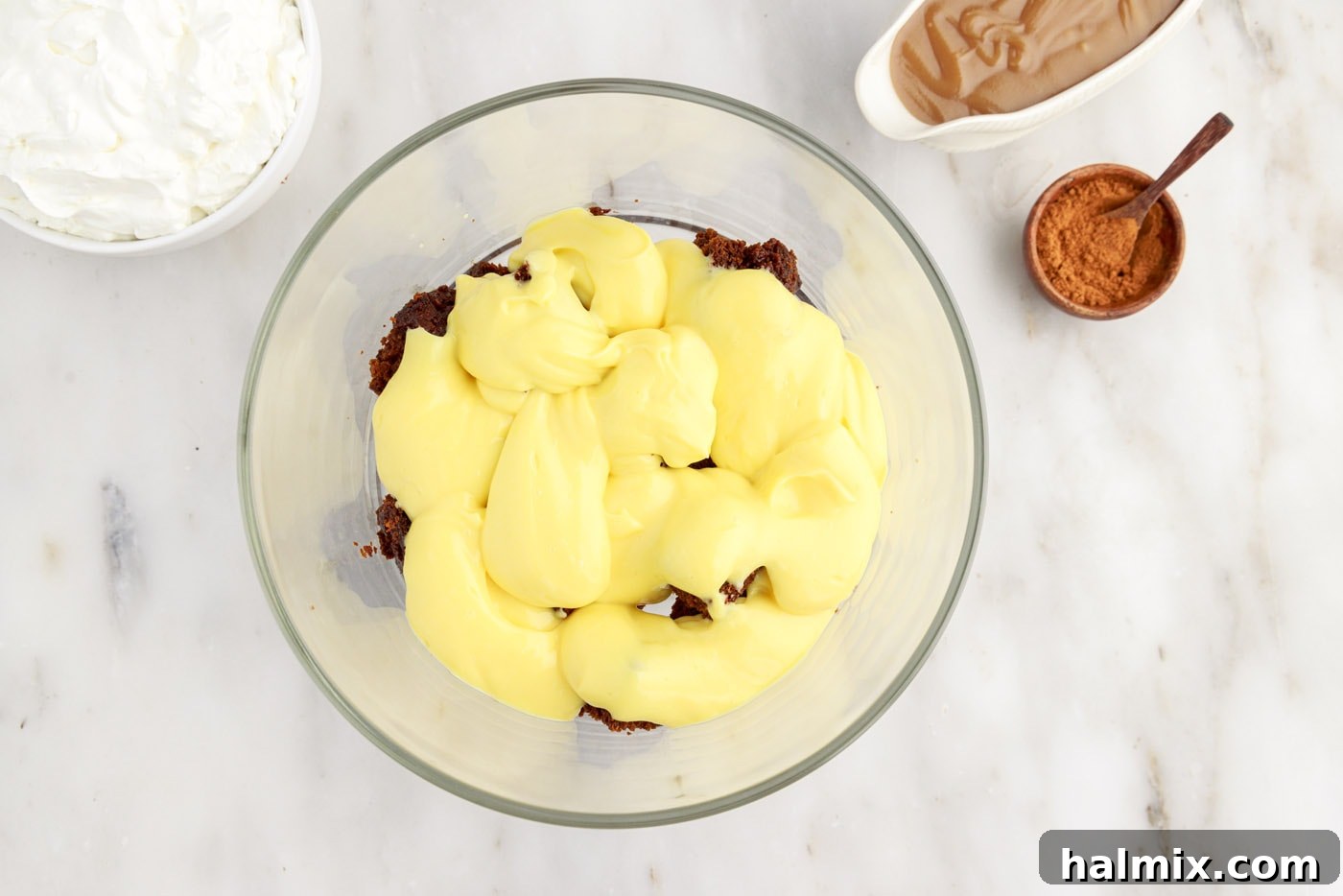 Layer of instant French vanilla pudding spread over gingerbread cake