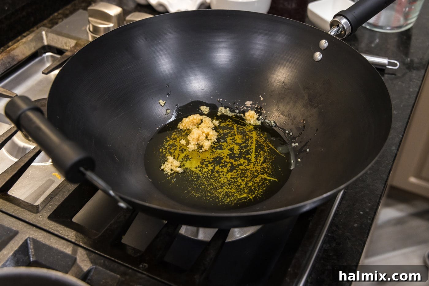 garlic in olive oil in a wok