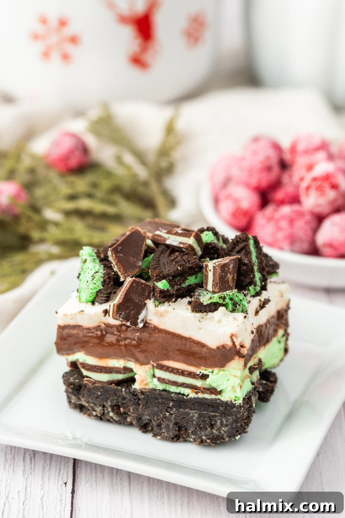 A close-up of a single Mint Chocolate Dream Bar on a plate, showcasing its distinct layers.