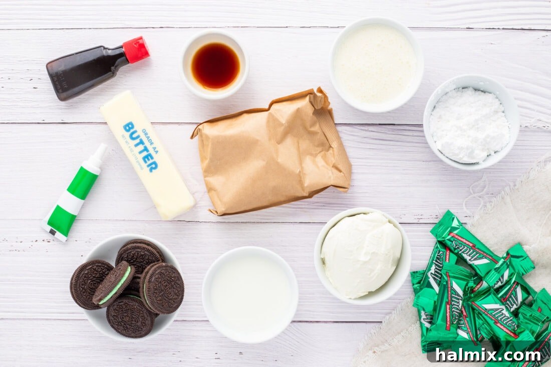 A collection of ingredients for Mint Chocolate Dream Bars, including Oreos, cream cheese, butter, pudding mix, and Andes mints.