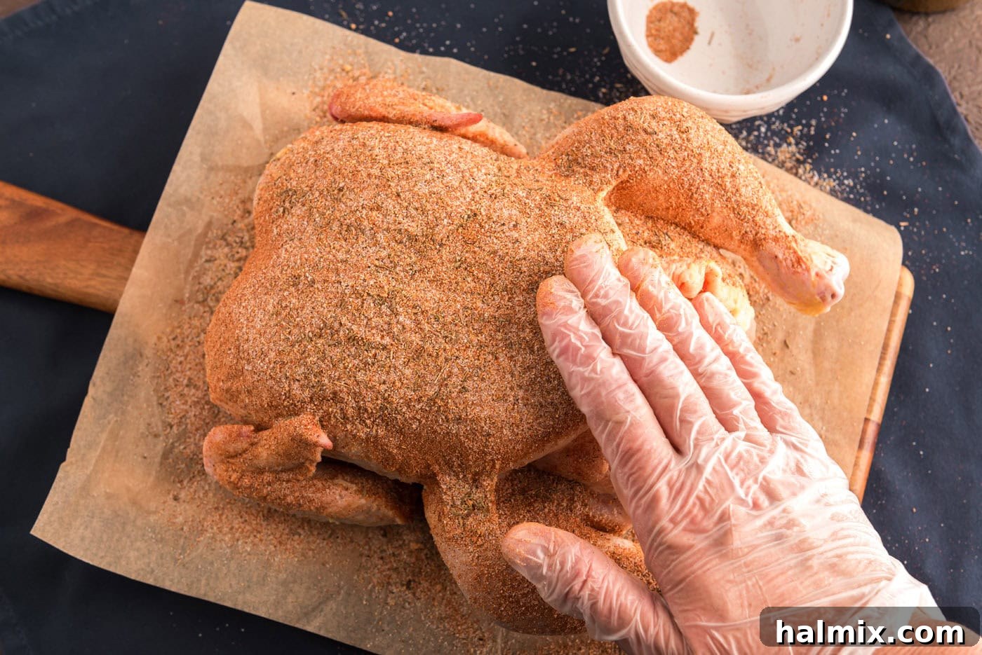 Irresistibly Sticky Slow Roasted Chicken 5 rubbing whole chicken with seasoning