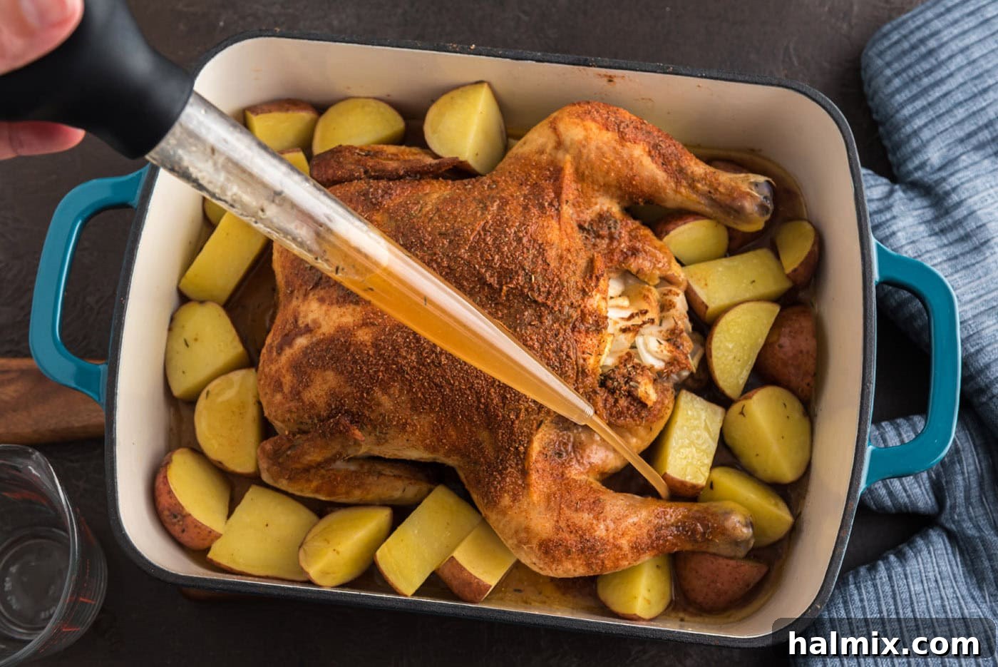 Irresistibly Sticky Slow Roasted Chicken 9 basting chicken in a roasting pan