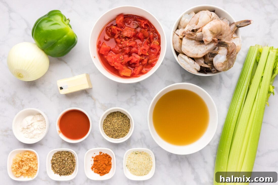 Spicy Shrimp Creole 4 Ingredients for Shrimp Creole laid out on a cutting board, including shrimp, vegetables, and spices.