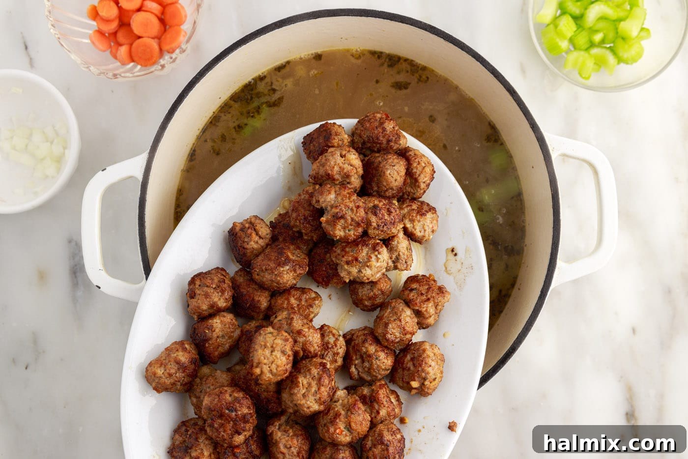 adding meatballs to Italian wedding soup