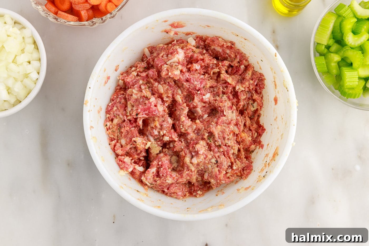 italian sausage and ground beef meatball ingredients in a bowl
