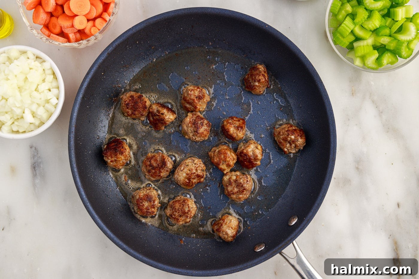 seared Italian meatballs in a skillet