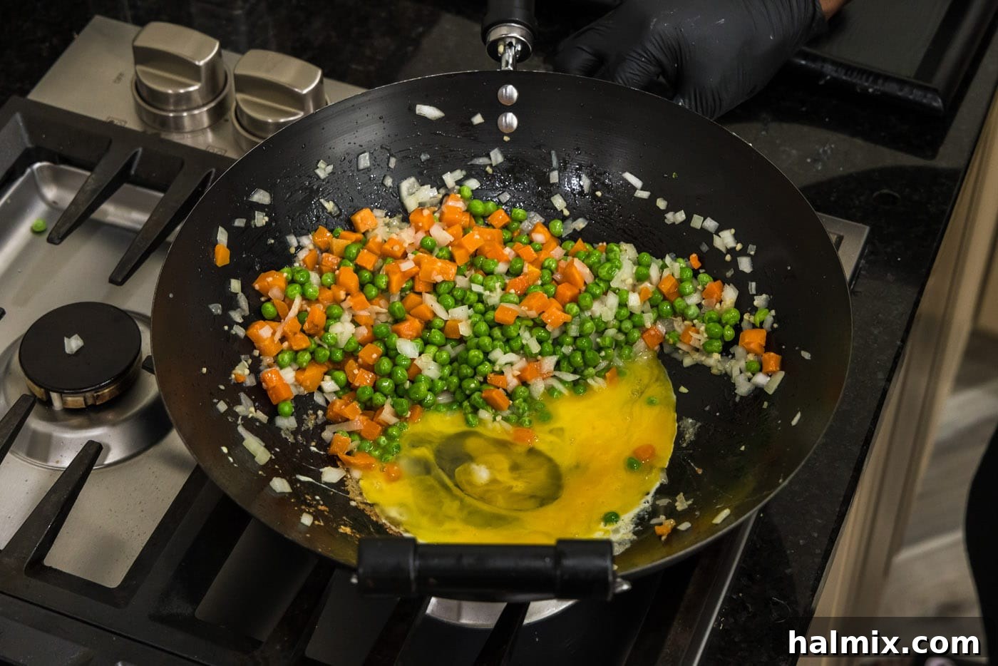 eggs scrambling next to stir fried vegetables