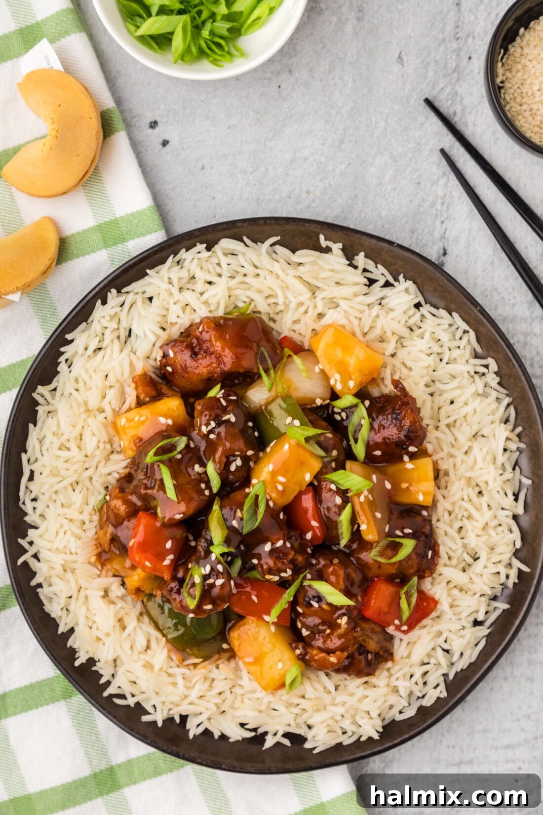 Golden Fried Pork with Tangy Glaze 2 Sweet and Sour Pork served on a plate over rice
