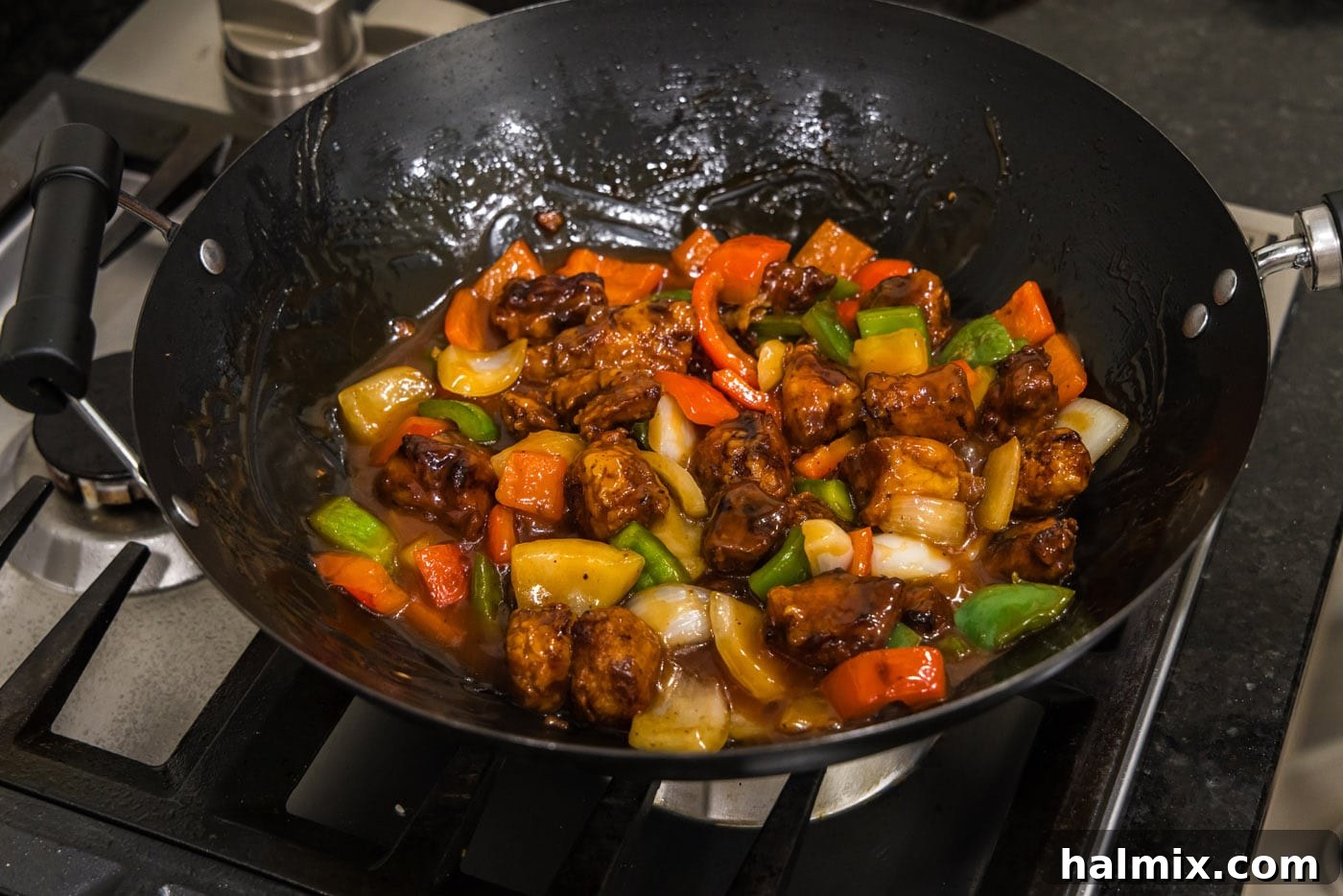 Golden Fried Pork with Tangy Glaze 17 sweet and sour pork in a wok