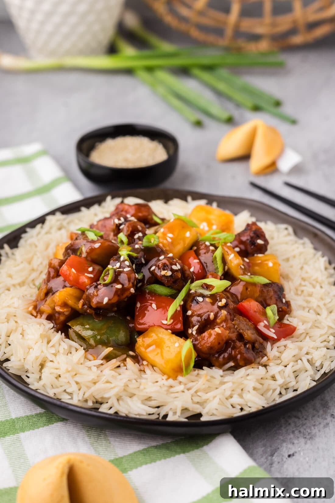 Golden Fried Pork with Tangy Glaze 18 Plate of Sweet and Sour Pork and rice on a plate