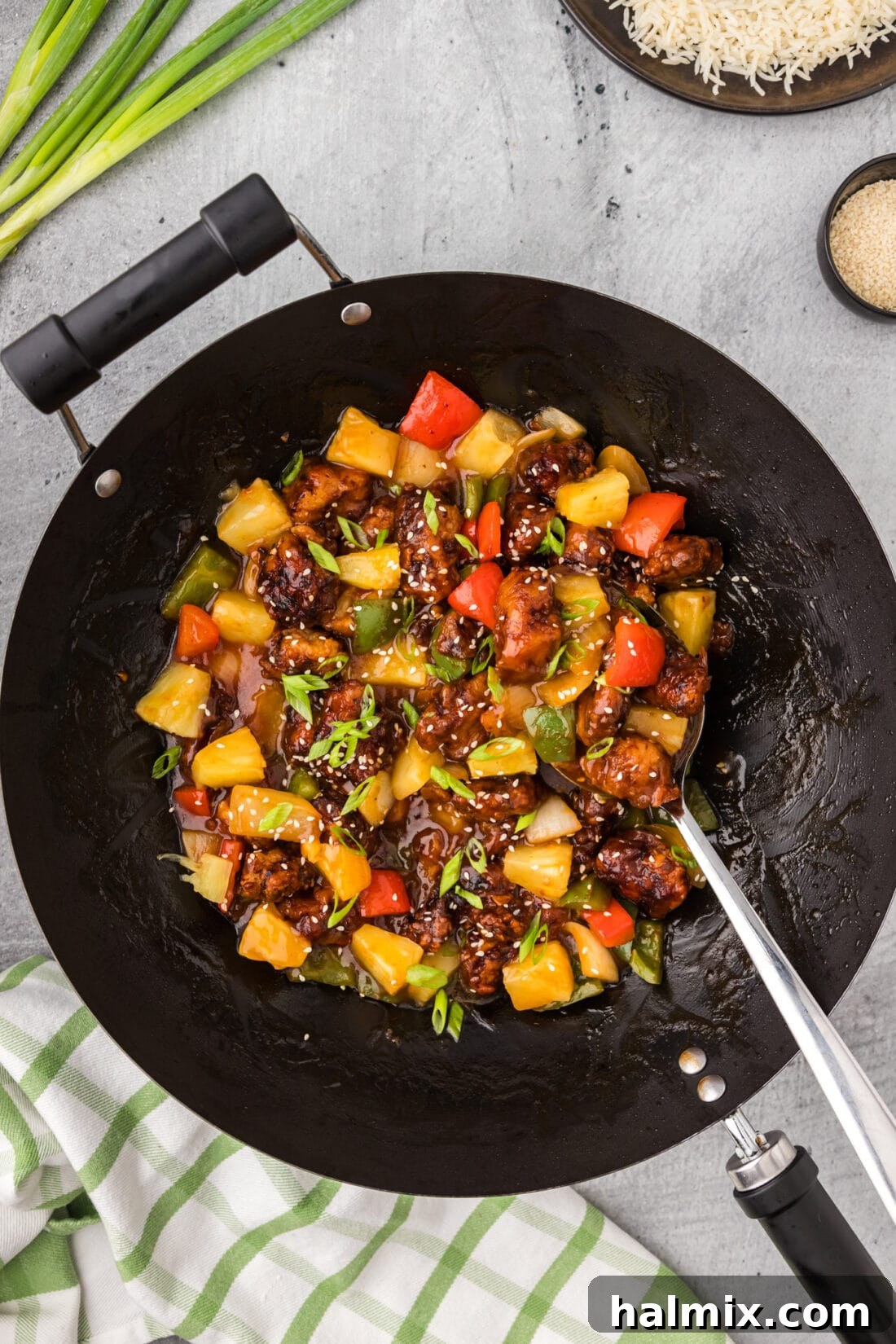 Golden Fried Pork with Tangy Glaze 3 Wok of Sweet and Sour Pork with a spoon in it