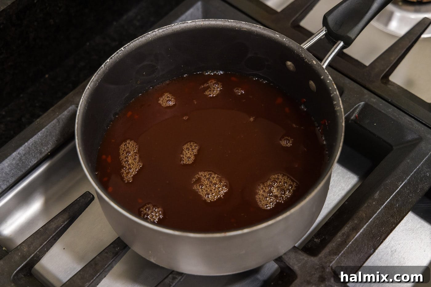 Golden Fried Pork with Tangy Glaze 6 sweet and sour sauce in a saucepan
