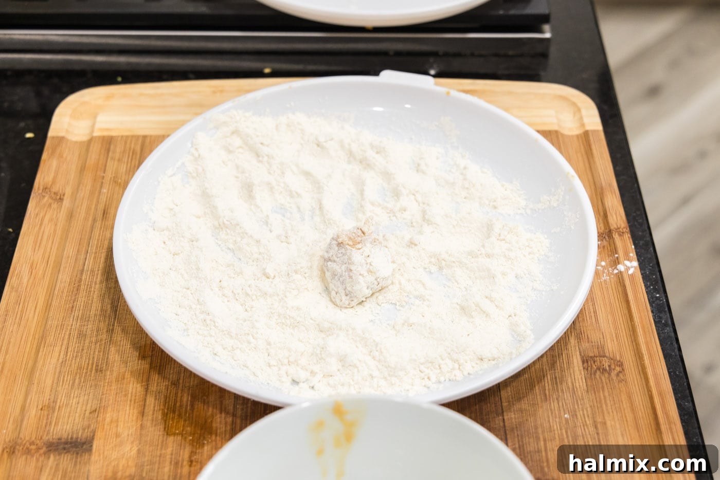 Golden Fried Pork with Tangy Glaze 10 coating pork in flour