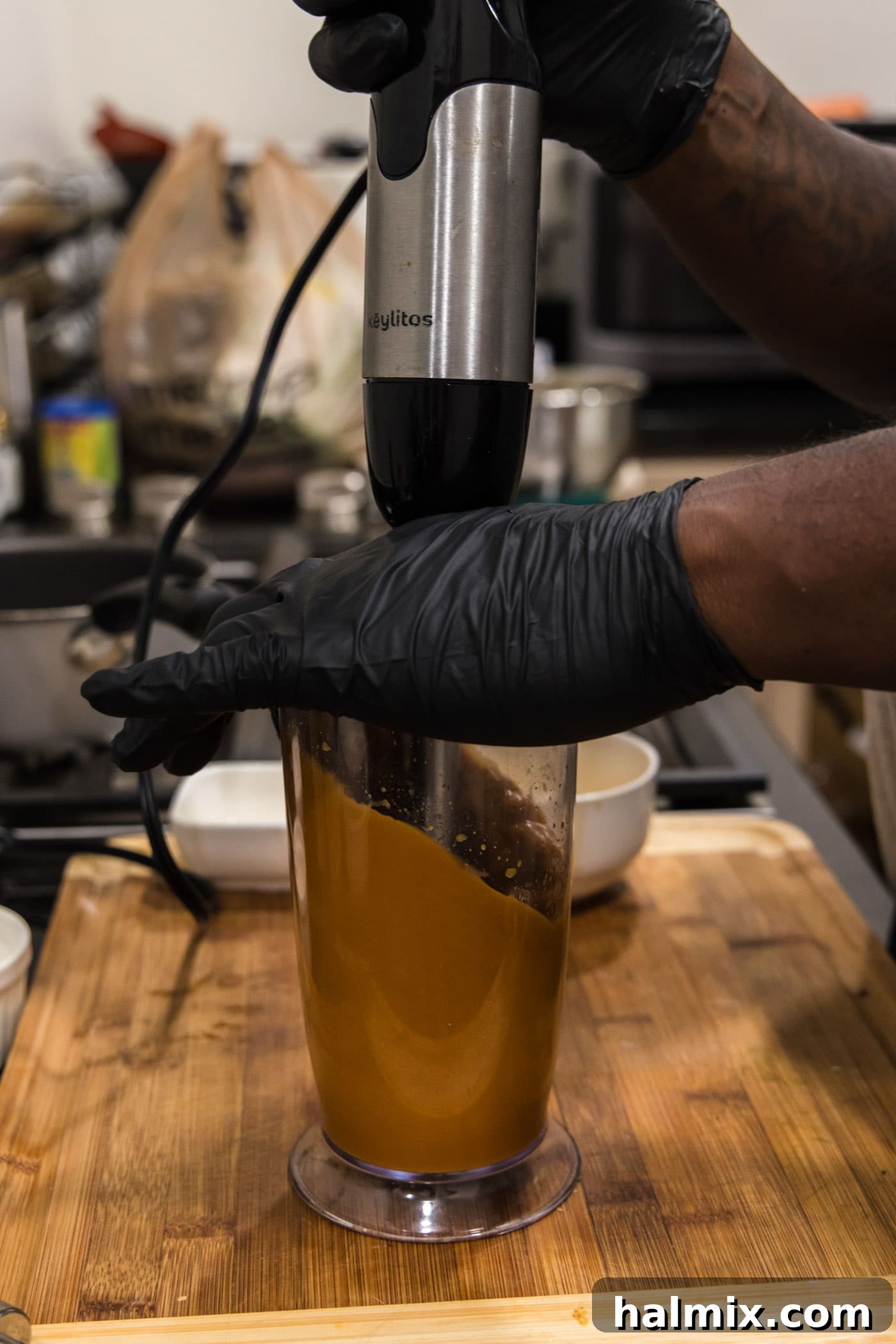 Blending the miso glaze in an immersion blender until silky smooth and perfectly uniform.