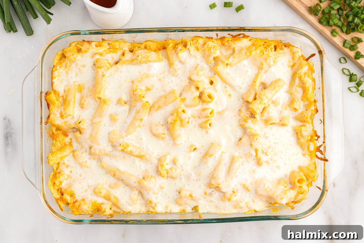 The baked buffalo chicken casserole, golden brown and bubbly, fresh out of the oven.