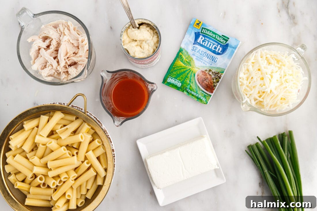 A vibrant display of all the ingredients needed to make Buffalo Chicken Casserole, neatly arranged.