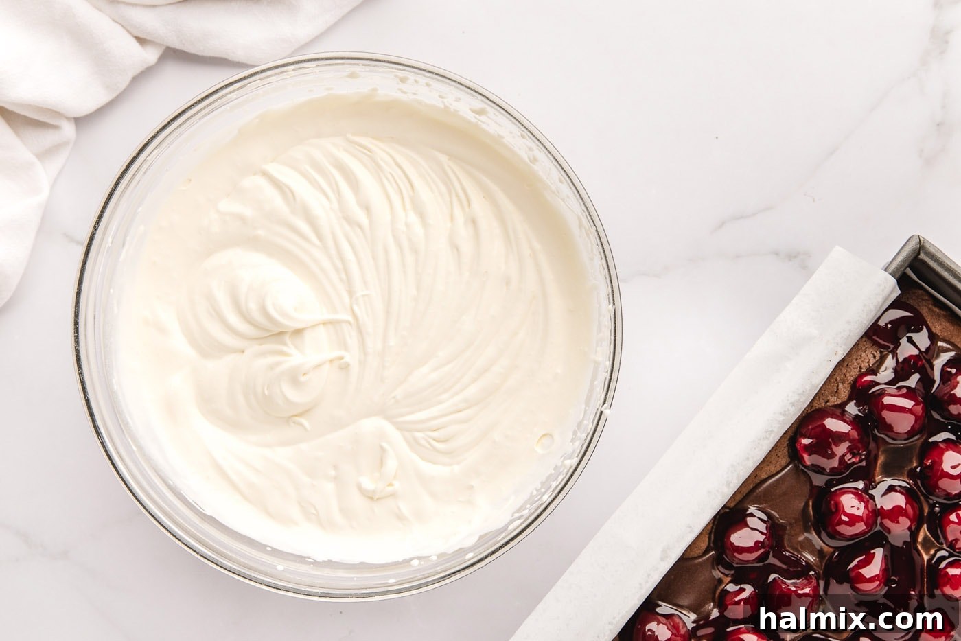 Decadent Black Forest Poke Cake 9 homemade whipped cream in a mixing bowl