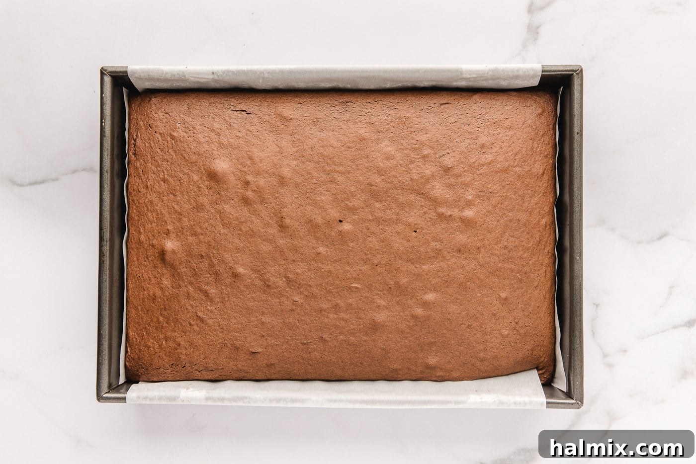 Decadent Black Forest Poke Cake 5 baked chocolate cake in a pan