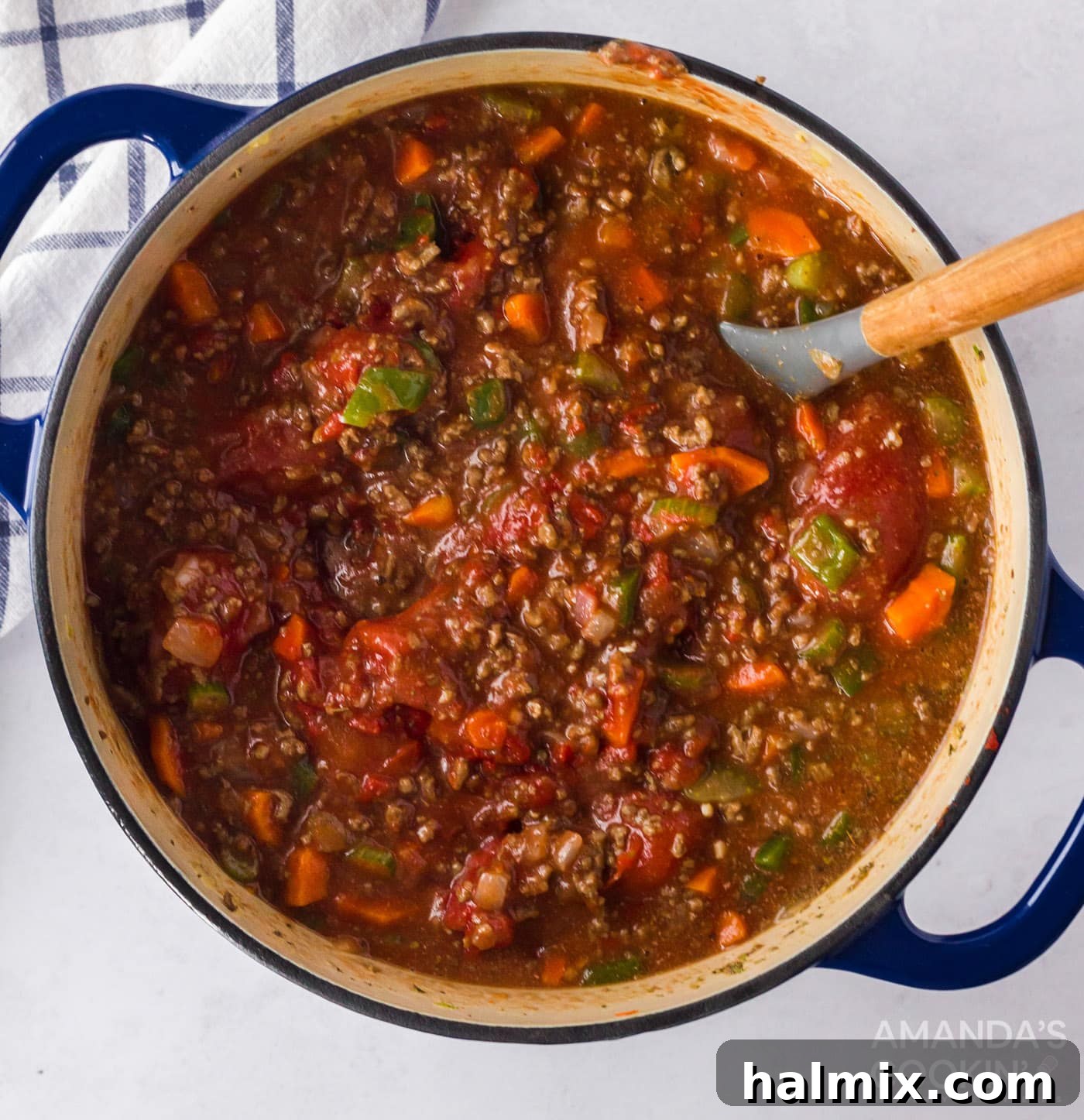 simmering pot of bolognese sauce